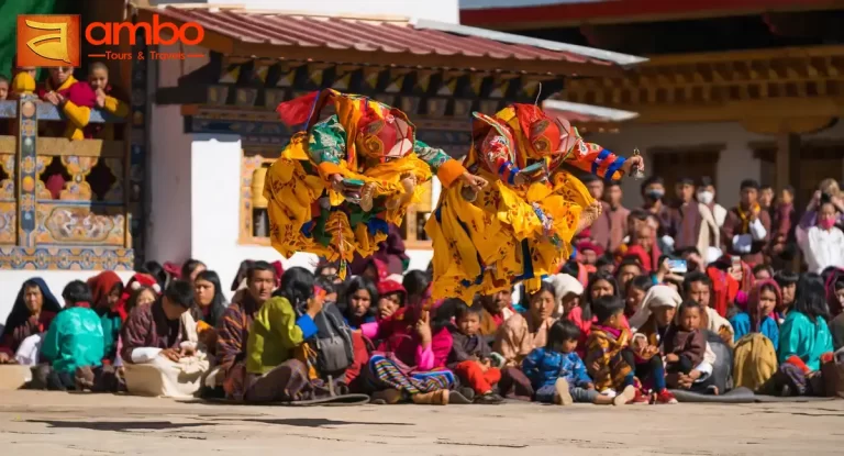 Wangdue Tshechu Festival at Wangdue Phodrang Dzong, Bhutan — monks performing sacred cham mask dances in the dzong courtyard
