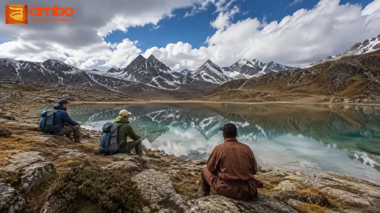 Trekkers beside Utsho Lake at 4,250m in the Dagala Range above Thimphu valley, Bhutan on the Dagala Thousand Lakes Trek